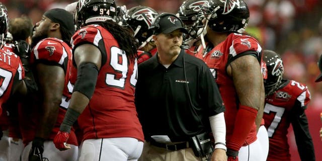 Oct 11, 2015; Atlanta, GA, USA; Atlanta Falcons head coach Dan Quinn leaves a defensive huddle in the second quarter of their game against the Washington Redskins at the Georgia Dome. Mandatory Credit: Jason Getz-USA TODAY Sports
