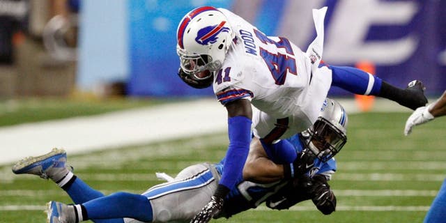 Sep 3, 2015; Detroit, MI, USA; Buffalo Bills running back Cierre Wood (41) gets tackled by Detroit Lions cornerback Quandre Diggs (28) during the fourth quarter of a preseason NFL football game at Ford Field. Lions beat the Bills 17-10. Mandatory Credit: Raj Mehta-USA TODAY Sports