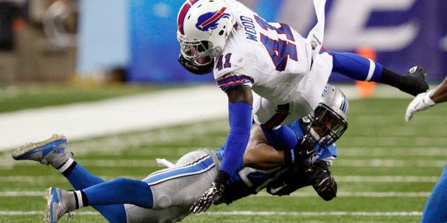 Sep 3, 2015; Detroit, MI, USA; Buffalo Bills running back Cierre Wood (41) gets tackled by Detroit Lions cornerback Quandre Diggs (28) during the fourth quarter of a preseason NFL football game at Ford Field. Lions beat the Bills 17-10. Mandatory Credit: Raj Mehta-USA TODAY Sports