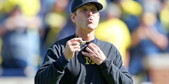 ANN ARBOR MI - OCTOBER 10: Michigan Wolverines head football coach Jim Harbaugh watches the pregame warms ups prior to the start of the game against the Northwestern Wildcats on October 10, 2015 at Michigan Stadium in Ann Arbor, Michigan. The Wolverines defeated the Wildcats 38-0. (Photo by Leon Halip/Getty Images)
