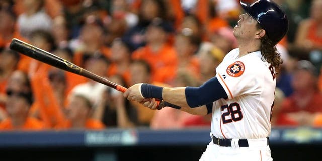 Oct 11, 2015; Houston, TX, USA; Houston Astros left fielder Colby Rasmus (28) hits a single off of the roof against the Kansas City Royals in game three of the ALDS at Minute Maid Park. Astros won 4-2. Mandatory Credit: Troy Taormina-USA TODAY Sports