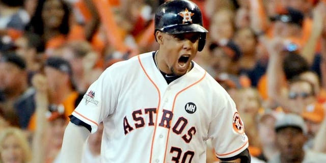 HOUSTON, TX - OCTOBER 11: Carlos Gomez #30 of the Houston Astros reacts after hitting an RBI single in the sixth inning against the Kansas City Royals in game three of the American League Division Series at Minute Maid Park on October 11, 2015 in Houston, Texas. (Photo by Eric Christian Smith/Getty Images)
