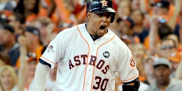 HOUSTON, TX - OCTOBER 11: Carlos Gomez #30 of the Houston Astros reacts after hitting an RBI single in the sixth inning against the Kansas City Royals in game three of the American League Division Series at Minute Maid Park on October 11, 2015 in Houston, Texas. (Photo by Eric Christian Smith/Getty Images)