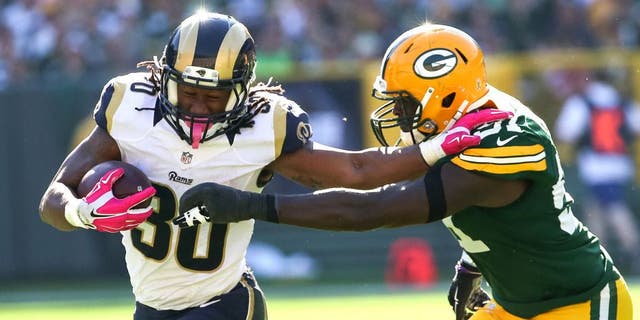 GREEN BAY, WI - OCTOBER 11: Todd Gurley #30 of the St. Louis Rams carries the football against Nate Palmer #51 of the Green Bay Packers in the third quarter at Lambeau Field on October 11, 2015 in Green Bay, Wisconsin. (Photo by Jonathan Daniel/Getty Images)