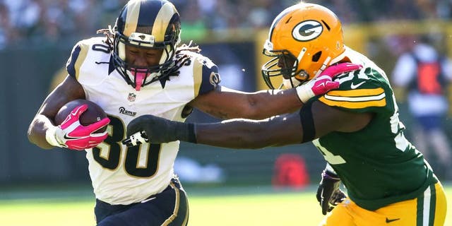 GREEN BAY, WI - OCTOBER 11: Todd Gurley #30 of the St. Louis Rams carries the football against Nate Palmer #51 of the Green Bay Packers in the third quarter at Lambeau Field on October 11, 2015 in Green Bay, Wisconsin. (Photo by Jonathan Daniel/Getty Images)