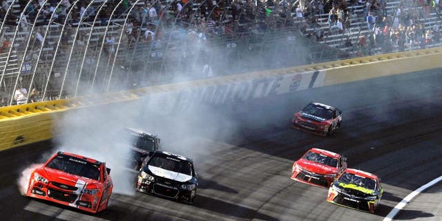 CHARLOTTE, NC - OCTOBER 11: Justin Allgaier, driver of the #51 Brandt Chevrolet, is involved in an on-track incident during the NASCAR Sprint Cup Series Bank of America 500 at Charlotte Motor Speedway on October 11, 2015 in Charlotte, North Carolina. (Photo by Jared C. Tilton/NASCAR via Getty Images)