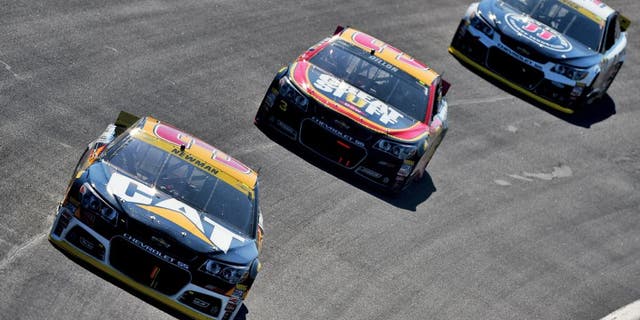 CHARLOTTE, NC - OCTOBER 11: Ryan Newman, driver of the #31 Caterpillar Chevrolet, leads Austin Dillon, driver of the #3 DOW - Great Stuff Chevrolet, and Kevin Harvick, driver of the #4 Jimmy John's/Budweiser Chevrolet, during the NASCAR Sprint Cup Series Bank of America 500 at Charlotte Motor Speedway on October 11, 2015 in Charlotte, North Carolina. (Photo by Josh Hedges/Getty Images)