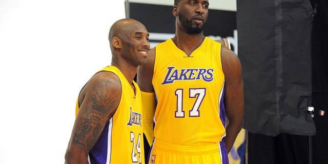 September 28, 2015; El Segundo, CA, USA; Los Angeles Lakers guard Kobe Bryant (left) and center Roy Hibbert pose for photographs during media day at Toyota Sports Center. Mandatory Credit: Gary A. Vasquez-USA TODAY Sports
