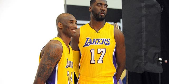 September 28, 2015; El Segundo, CA, USA; Los Angeles Lakers guard Kobe Bryant (left) and center Roy Hibbert pose for photographs during media day at Toyota Sports Center. Mandatory Credit: Gary A. Vasquez-USA TODAY Sports
