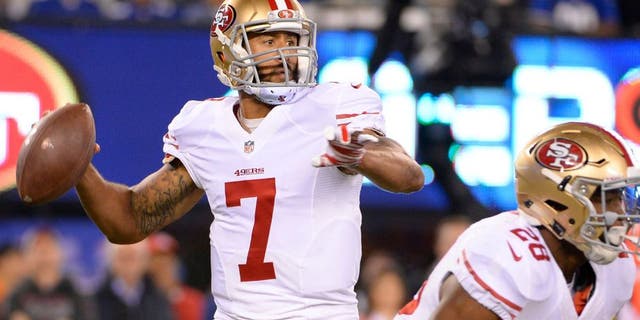 Oct 11, 2015; East Rutherford, NJ, USA; San Francisco 49ers quarterback Colin Kaepernick (7) throws the ball against the New York Giants in the second quarter at MetLife Stadium. Mandatory Credit: Robert Deutsch-USA TODAY Sports