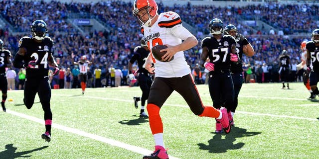 Oct 11, 2015; Baltimore, MD, USA; Cleveland Browns quarterback Josh McCown (13) scores a touchdown during the third quarter against the Baltimore Ravens at M&T Bank Stadium. Mandatory Credit: Tommy Gilligan-USA TODAY Sports