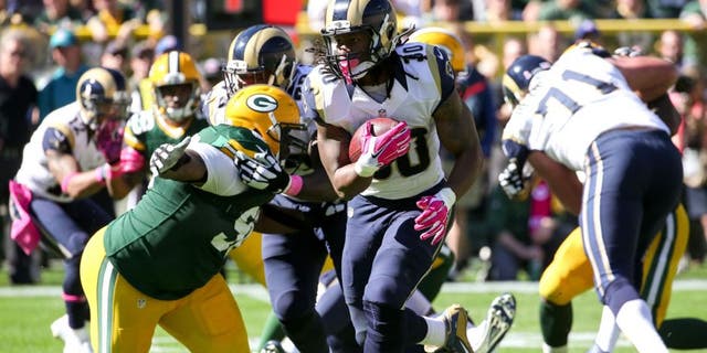 GREEN BAY, WI - OCTOBER 11: Todd Gurley #30 of the St. Louis Rams carries the football against the Green Bay Packers in the second quarter at Lambeau Field on October 11, 2015 in Green Bay, Wisconsin. (Photo by Jonathan Daniel/Getty Images)
