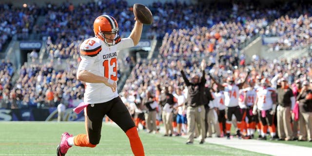 Cleveland Browns quarterback Josh McCown scores a touchdown in the second half of an NFL football gameÂ against the Baltimore Ravens, Sunday, Oct. 11, 2015, in Baltimore. (AP Photo/Gail Burton)