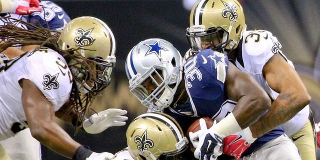 Oct 4, 2015; New Orleans, LA, USA; New Orleans Saints cornerback Brandon Browner (39) and defensive end Bobby Richardson (78) tackle Dallas Cowboys running back Christine Michael (30) during the fourth quarter at the Mercedes-Benz Superdome. The Saints won 26-20 in overtime. Mandatory Credit: Derick E. Hingle-USA TODAY Sports