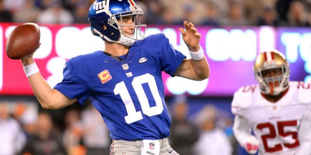 Oct 11, 2015; East Rutherford, NJ, USA; New York Giants quarterback Eli Manning (10) throws the ball in the first quarter against the San Francisco 49ers at MetLife Stadium. Mandatory Credit: Robert Deutsch-USA TODAY Sports