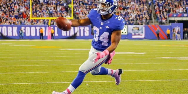 Oct 11, 2015; East Rutherford, NJ, USA; New York Giants running back Shane Vereen (34) scores a touchdown during the second quarter against the San Francisco 49ers at MetLife Stadium. Mandatory Credit: Jim O'Connor-USA TODAY Sports