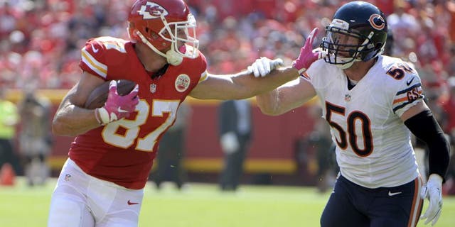 Oct 11, 2015; Kansas City, MO, USA; Chicago Bears inside linebacker Shea McClellin (50) reaches to tackle Kansas City Chiefs tight end Travis Kelce (87) in the first half at Arrowhead Stadium. Mandatory Credit: John Rieger-USA TODAY Sports