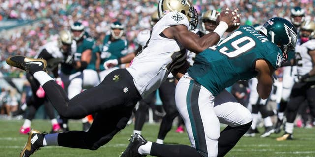 Oct 11, 2015; Philadelphia, PA, USA; New Orleans Saints cornerback Delvin Breaux (40) intercepts a pass intended for Philadelphia Eagles wide receiver Miles Austin (19) during the second quarter at Lincoln Financial Field. Mandatory Credit: Bill Streicher-USA TODAY Sports