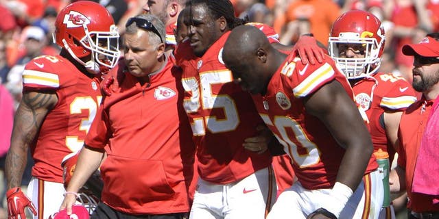 Oct 11, 2015; Kansas City, MO, USA; Kansas City Chiefs running back Jamaal Charles (25) is helped off the field against the Chicago Bears in the second half at Arrowhead Stadium. Chicago won the game 18-17. Mandatory Credit: John Rieger-USA TODAY Sports