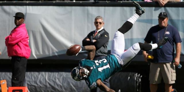 Philadelphia Eagles' Josh Huff flips into the end zone for a touchdown during the first half of an NFL football game against the New Orleans Saints, Sunday, Oct. 11, 2015, in Philadelphia. (AP Photo/Michael Perez)