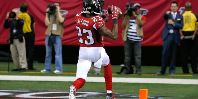 ATLANTA, GA - OCTOBER 11: Robert Alford #23 of the Atlanta Falcons returns an interception for a touchdown in their 25-19 overtime win against the Washington Redskins at Georgia Dome on October 11, 2015 in Atlanta, Georgia. (Photo by Kevin C. Cox/Getty Images)