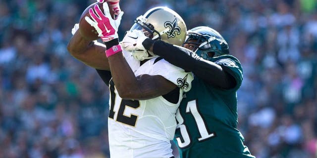 Oct 11, 2015; Philadelphia, PA, USA; New Orleans Saints wide receiver Marques Colston (12) makes a catch against the defense of Philadelphia Eagles cornerback Byron Maxwell (31) during the third quarter at Lincoln Financial Field. Mandatory Credit: Bill Streicher-USA TODAY Sports