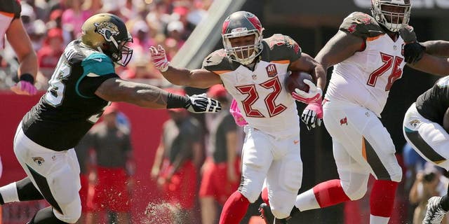 TAMPA, FL - OCTOBER 11: Doug Martin #22 of the Tampa Bay Buccaneers rushes during a game against the Jacksonville Jaguars at Raymond James Stadium on October 11, 2015 in Tampa, Florida. (Photo by Mike Ehrmann/Getty Images)
