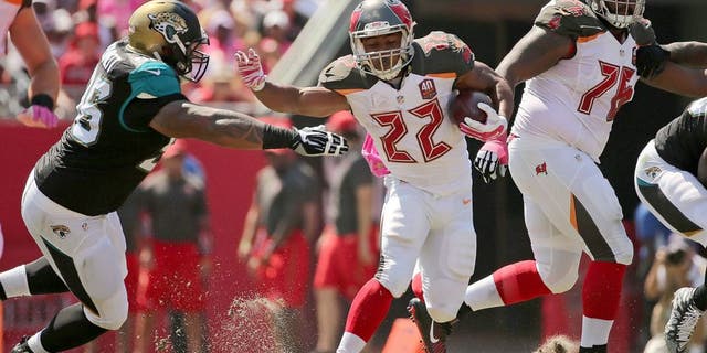 TAMPA, FL - OCTOBER 11: Doug Martin #22 of the Tampa Bay Buccaneers rushes during a game against the Jacksonville Jaguars at Raymond James Stadium on October 11, 2015 in Tampa, Florida. (Photo by Mike Ehrmann/Getty Images)