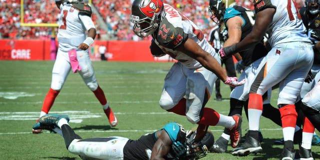 TAMPA, FL - OCTOBER 11: Running back Doug Martin #22 of the Tampa Bay Buccaneers scores a touchdown against the Jacksonville Jaguars in the second quarter at Raymond James Stadium on October 11, 2015 in Tampa, Florida. (Photo by Cliff McBride/Getty Images)