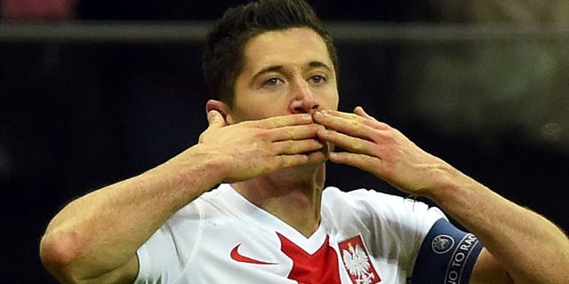 Poland's Robert Lewandowski reacts after scoring a goal during the Euro 2016 Group D qualifying football match between Poland and the Republic of Ireland at the Stadion Narodowy in Warsaw on October 11, 2015. AFP PHOTO / JANEK SKARZYNSKI (Photo credit should read JANEK SKARZYNSKI/AFP/Getty Images)