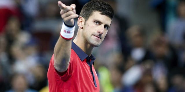 BEIJING, CHINA - OCTOBER 11: Novak Djokovic of Serbia celebrates after winning the Men's Single Final match against Rafael Nadal of Spain on day 9 of the 2015 China Open at the China National Tennis Centre on October 11, 2015 in Beijing, China. (Photo by Lintao Zhang/Getty Images)