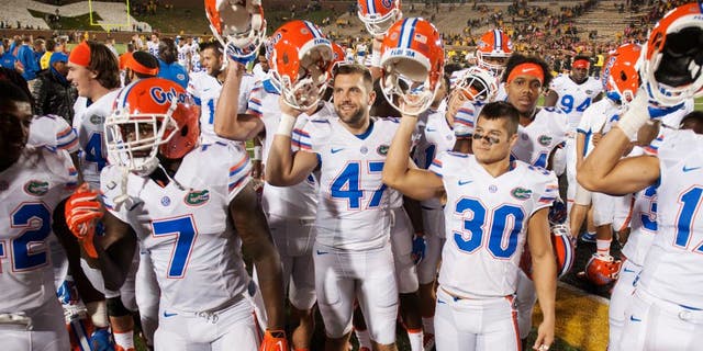 Florida teammates celebrate with their fans after they beat Missouri 21-3 in an NCAA college football game, Saturday, Oct. 10 2015, in Columbia, Mo. (AP Photo/L.G. Patterson)