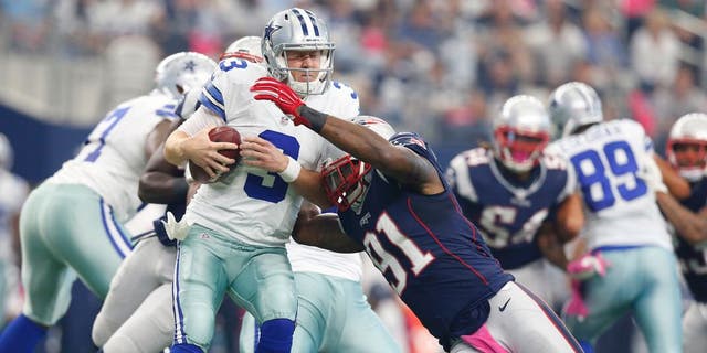 Oct 11, 2015; Arlington, TX, USA; Dallas Cowboys quarterback Brandon Weeden (3) is sacked by New England Patriots linebacker Jamie Collins (91) at AT&T Stadium. Mandatory Credit: Matthew Emmons-USA TODAY Sports