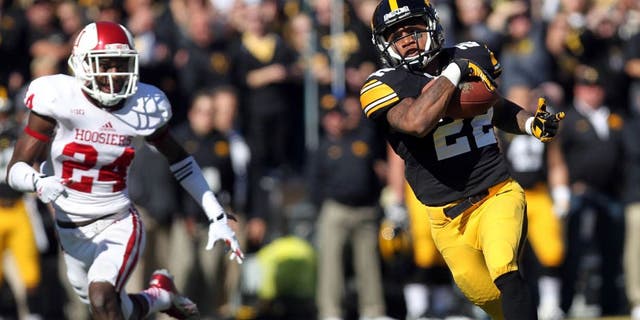 Oct 11, 2014; Iowa City, IA, USA; Iowa Hawkeyes wide receiver Damond Powell (22) catches a pass for a touch down against the Indiana Hoosiers at Kinnick Stadium. Mandatory Credit: Reese Strickland-USA TODAY Sports