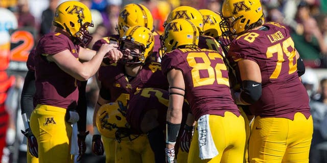 Oct 11, 2014; Minneapolis, MN, USA; Minnesota Golden Gophers quarterback Mitch Leidner (7) calls out a play to the rest of the Minnesota Golden Gophers offense in first half against the Northwestern Wildcats at TCF Bank Stadium. Mandatory Credit: Jesse Johnson-USA TODAY Sports
