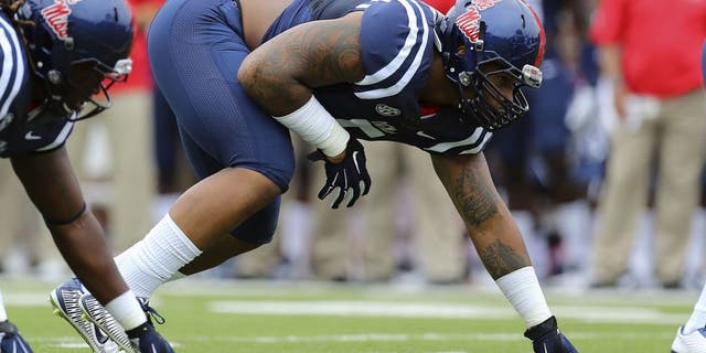 Sep 13, 2014; Oxford, MS, USA; Mississippi Rebels defensive tackle Robert Nkemdiche (5) steps up to the line during the game against the Louisiana-Lafayette Ragin Cajuns at Vaught-Hemingway Stadium. Mandatory Credit: Spruce Derden-USA TODAY Sports