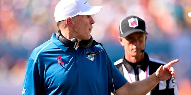 Oct 12, 2014; Miami Gardens, FL, USA; Miami Dolphins head coach Joe Philbin complains to the referee in the second half of the game at Sun Life Stadium. Green Bay defeated Miami 27-24. Mandatory Credit: Brad Barr-USA TODAY Sports