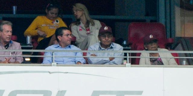 Oct 12, 2014; Glendale, AZ, USA; Washington Redskins owner Dan Snyder (left) talks with Navajo Nation president Ben Shelly (right) during the first half against the Arizona Cardinals at University of Phoenix Stadium. Mandatory Credit: Matt Kartozian-USA TODAY Sports