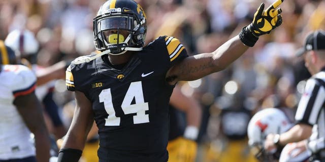Oct 10, 2015; Iowa City, IA, USA; Iowa Hawkeyes defensive back Desmond King (14) signals for the first down late in the fourth quarter after Iowa recovered a fumble against the Illinois Fighting Illini at Kinnick Stadium. Iowa beat Illinois 29-20. Mandatory Credit: Reese Strickland-USA TODAY Sports