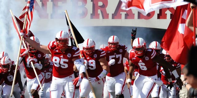 Oct 10, 2015; Lincoln, NE, USA; Nebraska Cornhuskers defensive end Jack Gangwish (95) leads the team on the field against the Wisconsin Badgers at Memorial Stadium. Mandatory Credit: Steven Branscombe-USA TODAY Sports