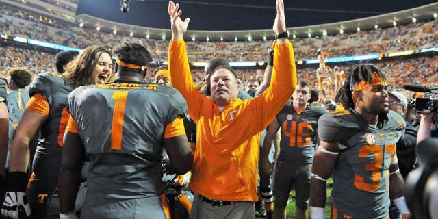 Oct 10, 2015; Knoxville, TN, USA; Tennessee Volunteers head coach Butch Jones waves to fans after his team defeated the Georgia Bulldogs during the second half at Neyland Stadium. Tennessee won 38-31. Mandatory Credit: Jim Brown-USA TODAY Sports