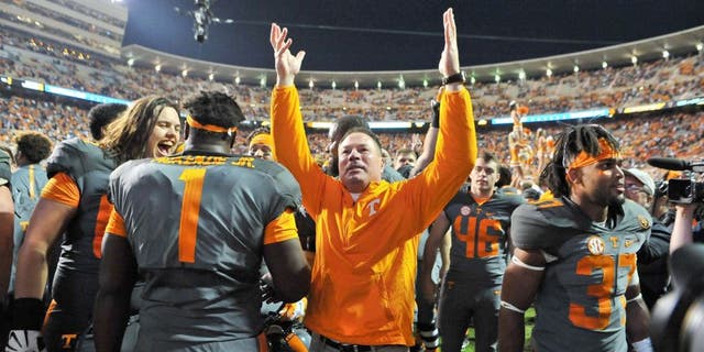 Oct 10, 2015; Knoxville, TN, USA; Tennessee Volunteers head coach Butch Jones waves to fans after his team defeated the Georgia Bulldogs during the second half at Neyland Stadium. Tennessee won 38-31. Mandatory Credit: Jim Brown-USA TODAY Sports