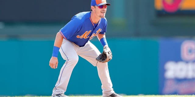 LAKE BUENA VISTA, FL - MARCH 10: Matt Reynolds #55 of the New York Mets gets ready to field the ball during the Spring Training game against the Atlanta Braves at Champion Stadium on March 10, 2015 in Lake Buena Vista, Florida. The Braves defeated the Mets 3-2. (Photo by Leon Halip/Getty Images)