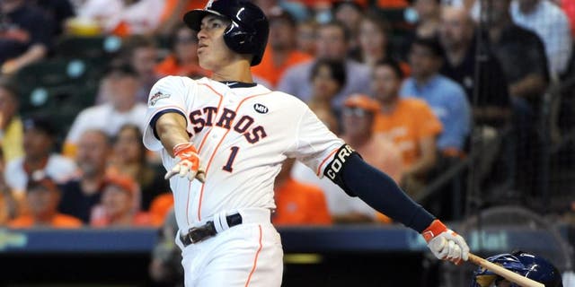 HOUSTON, TX - OCTOBER 12: Carlos Correa #1 of the Houston Astros hits a solo home run to tie the game in the third inning against the Kansas City Royals during game four of the American League Divison Series at Minute Maid Park on October 12, 2015 in Houston, Texas. (Photo by Eric Christian Smith/Getty Images)