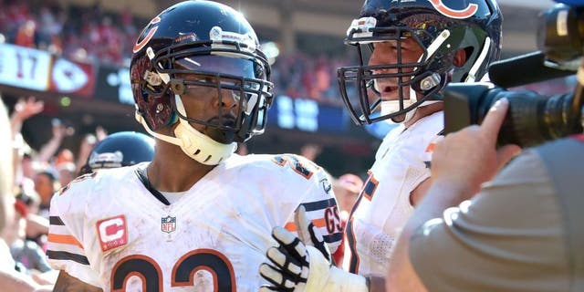 Oct 11, 2015; Kansas City, MO, USA; Chicago Bears running back Matt Forte (22) is congratulated by tackle Charles Leno (72) after scoring the winning touchdown during the second half against the Kansas City Chiefs at Arrowhead Stadium. The Bears won 18-17. Mandatory Credit: Denny Medley-USA TODAY Sports