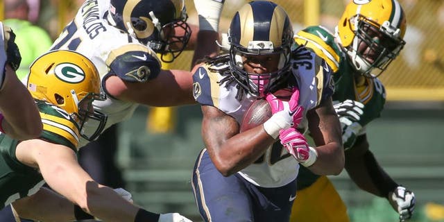 GREEN BAY, WI - OCTOBER 11: Todd Gurley #30 of the St. Louis Rams carries the football against the Green Bay Packers in the second quarter at Lambeau Field on October 11, 2015 in Green Bay, Wisconsin. (Photo by Jonathan Daniel/Getty Images)