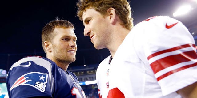 FOXBORO, MA - AUGUST 29: Tom Brady #12 of the New England Patriots talks to Eli Manning #10 of the New York Giants following their preseason game at Gillette Stadium on August 29, 2013 in Foxboro, Massachusetts. (Photo by Jared Wickerham/Getty Images)