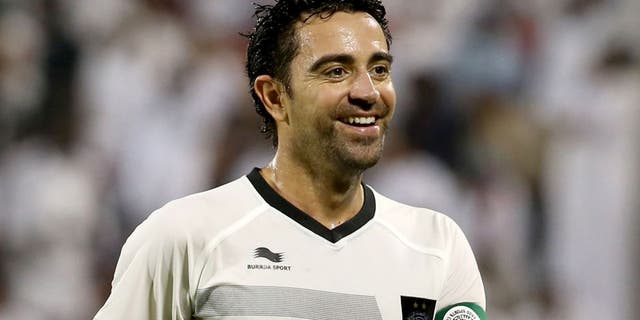 Barcelona football legend Xavi Hernandez who recently signed with Qatar's Al-Sadd club smiles during their Qatar Stars League football match against Al-Mesaimeer in Doha on September 13, 2015. AFP PHOTO / AL-WATAN DOHA / KARIM JAAFAR == QATAR OUT == (Photo credit should read KARIM JAAFAR/AFP/Getty Images)