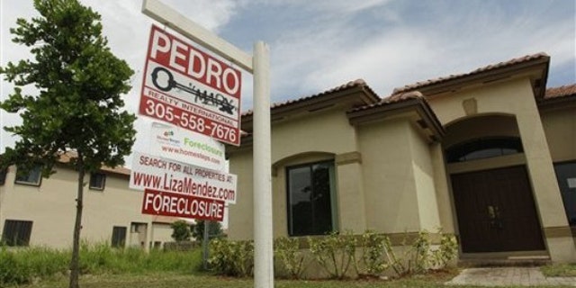 Sept. 14: A foreclosed home sits empty in a Homestead, Fla., neighborhood where half of the houses are empty and up for foreclosure.