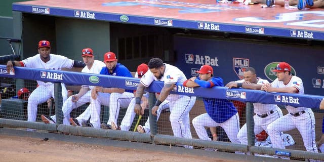 Oct 12, 2015; Arlington, TX, USA; Texas Rangers designated hitter Prince Fielder (middle) reacts with teammates during the game against the Toronto Blue Jays in game four of the ALDS at Globe Life Park in Arlington. Mandatory Credit: Kevin Jairaj-USA TODAY Sports